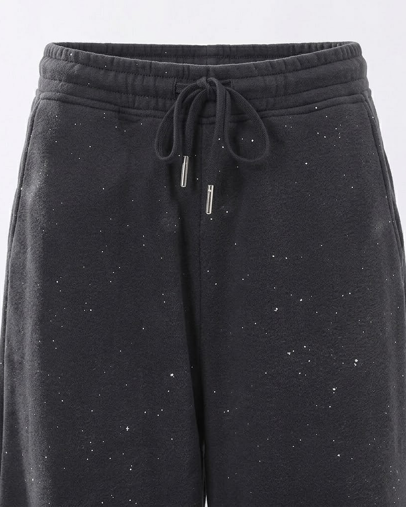 Close-up of the dark grey pants elastic waist and drawstring