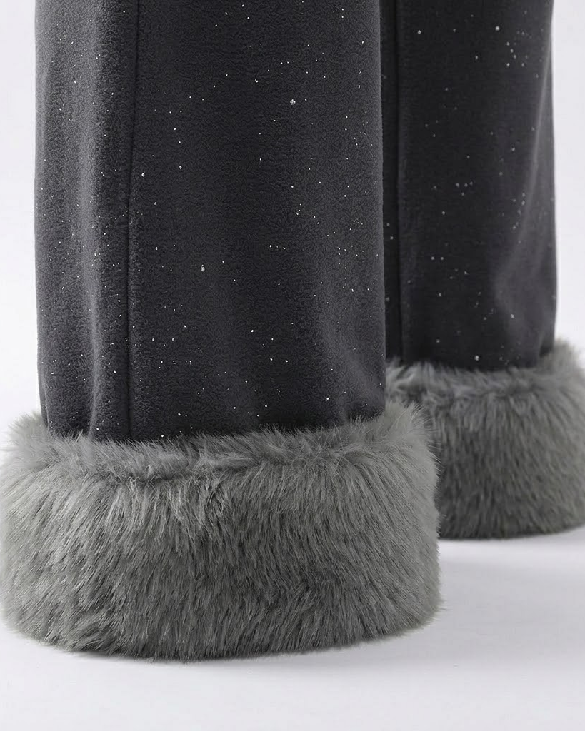 Close-up of the plush fur cuffs on the dark grey wide-leg pants